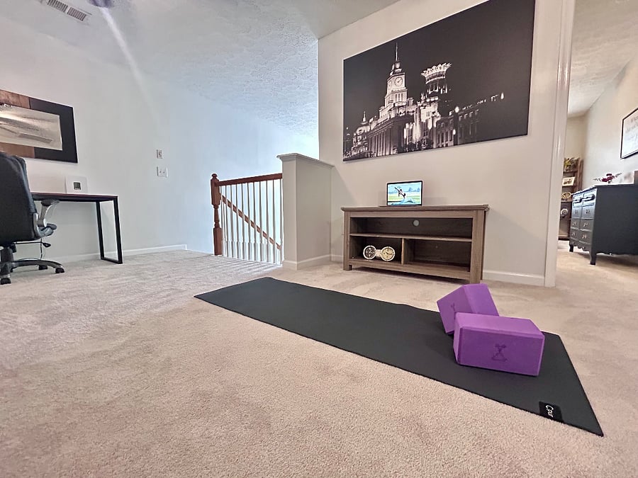 Ample space for yoga, weights or stationary bike on plush, new carpet.