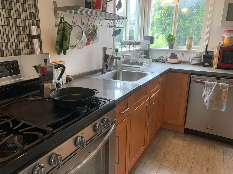 Kitchen with gas range and deep sink, plus everything you need to cook.