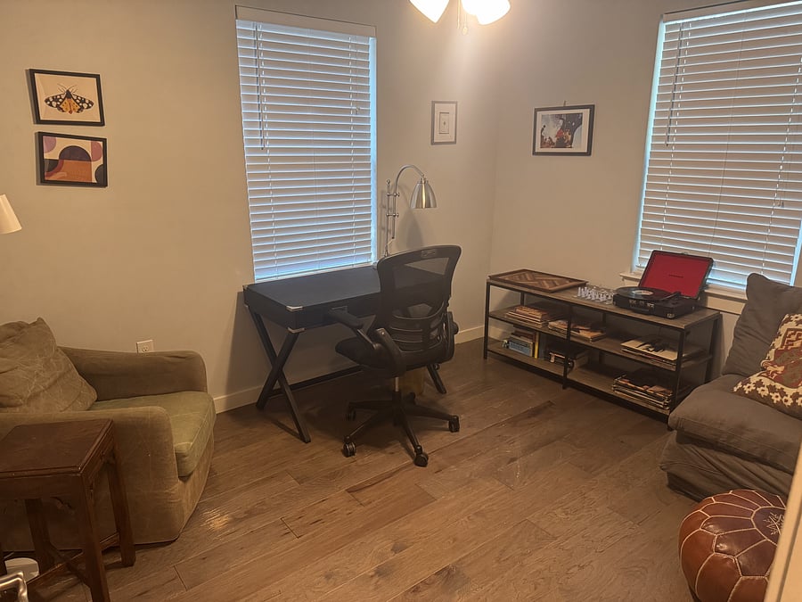 Office with extra seating for a cozy place to read or work.