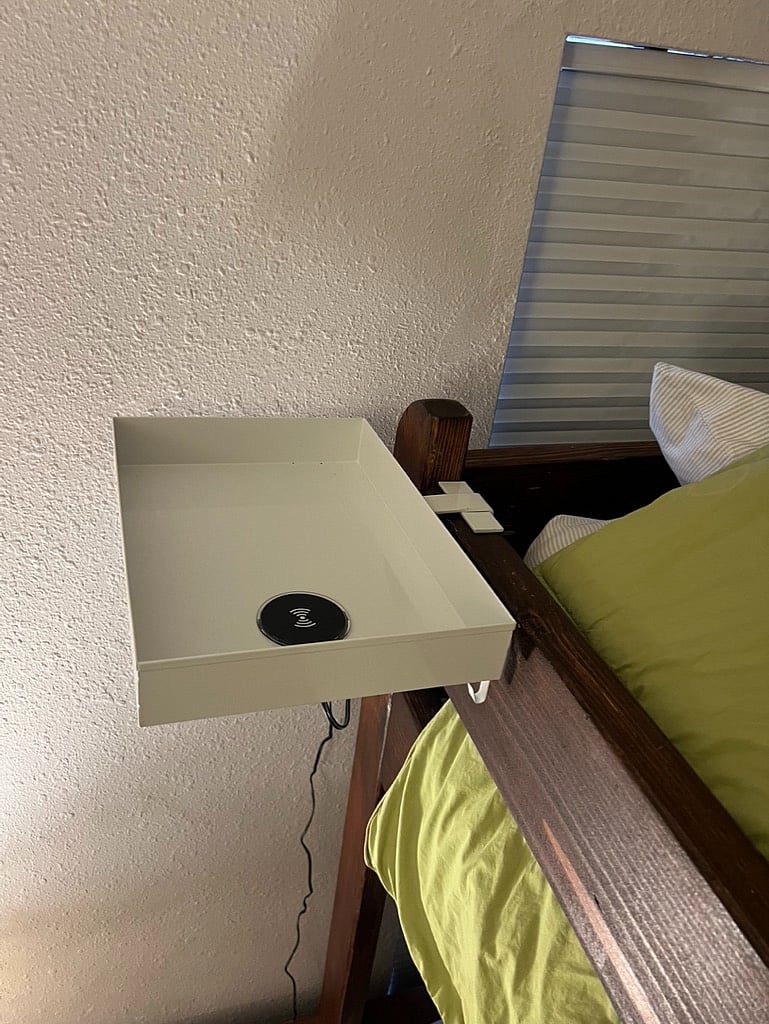 Charging pad with space for holding phone/tablet while in top bunk