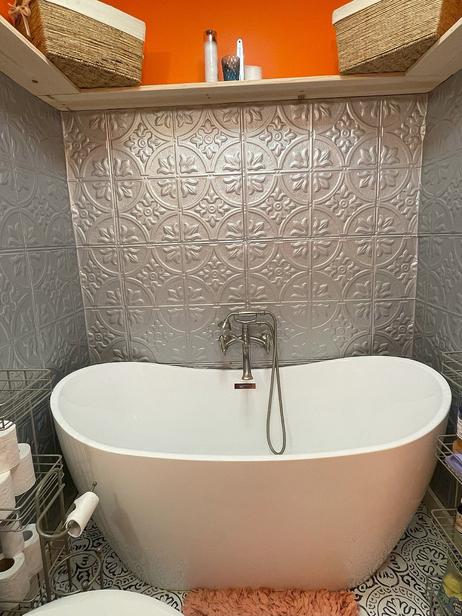 Primary bathroom has a giant, two person free standing bathtub