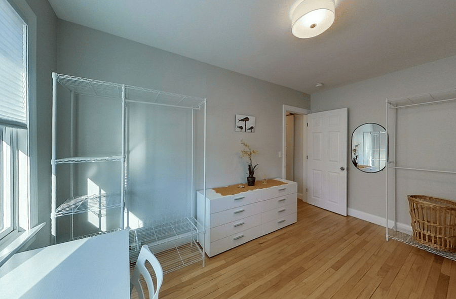 Walk in closet for Master Suite, including small desk for remote work.