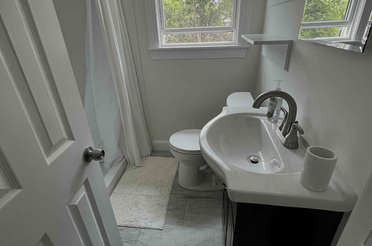 Guest bathroom with large shower.