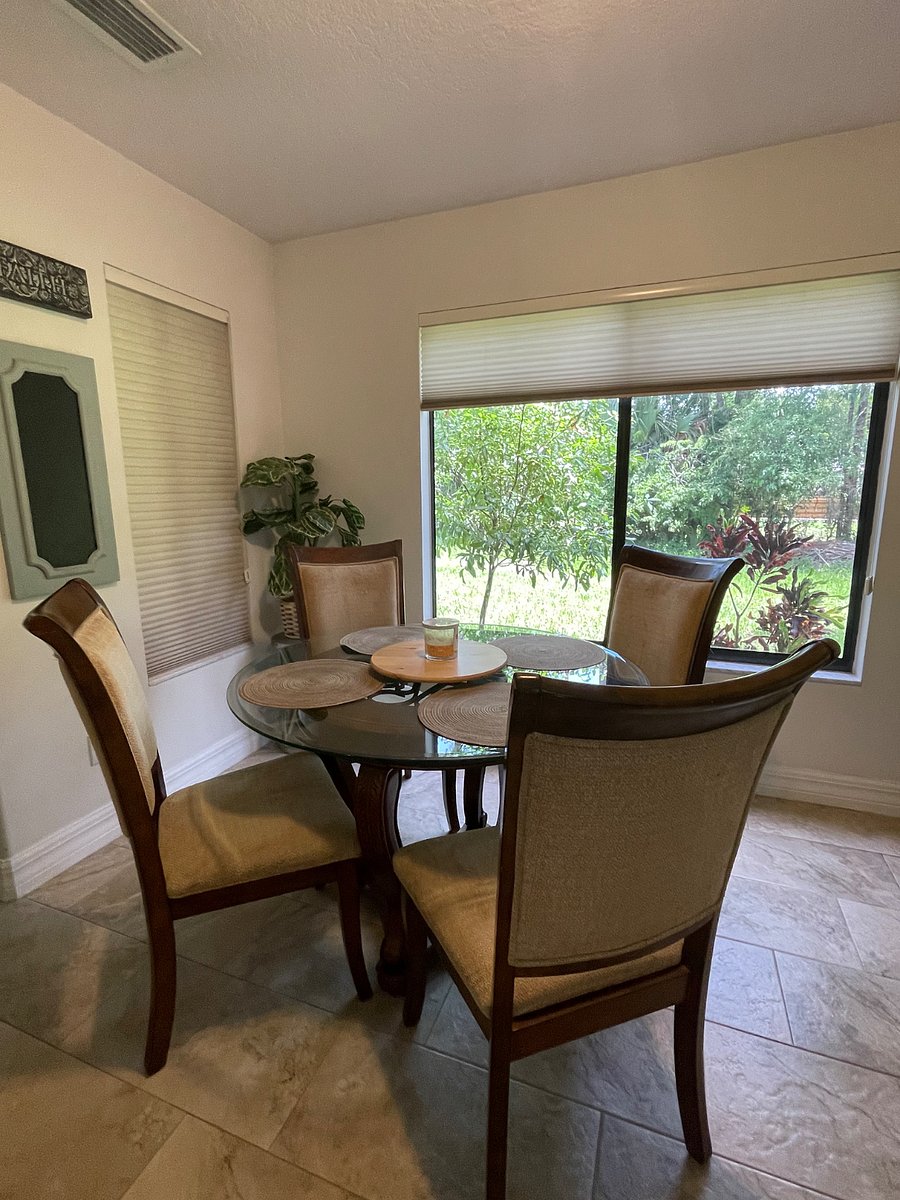 Comfortable sunny seating w view of back yard. 