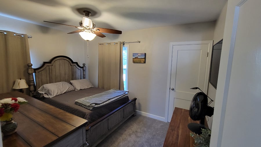 Main floor bedroom, across the hall from bathroom.
