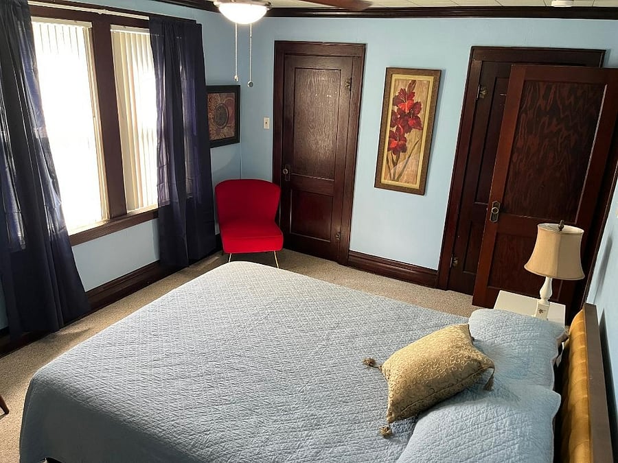 This room was recently painted and room darkening curtains added.