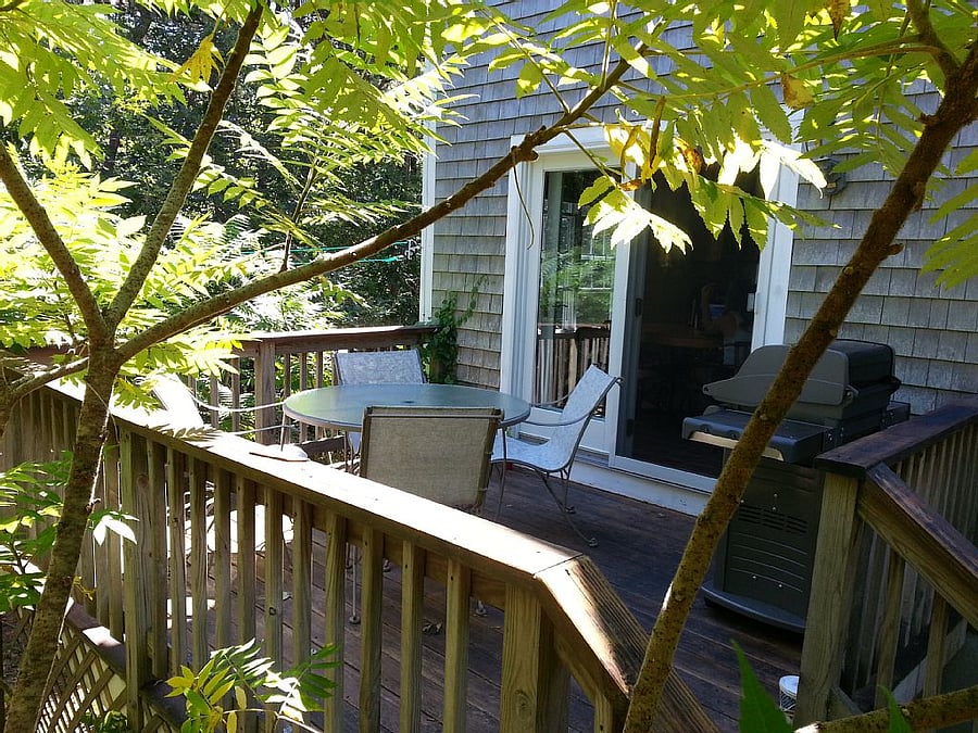 Side deck off the kitchen, grill and seating