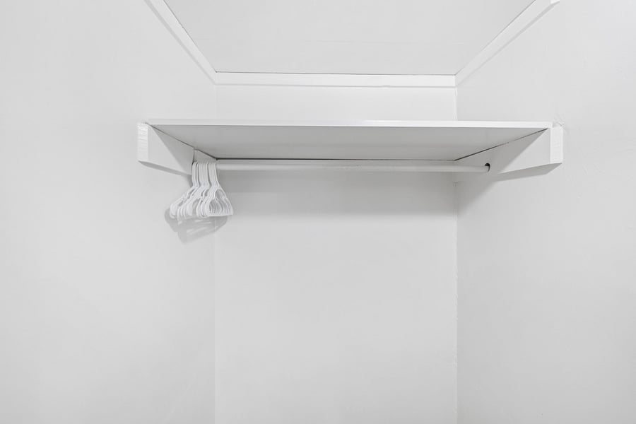 Side 1: Bedroom 1 Walk-in Closet with hangers