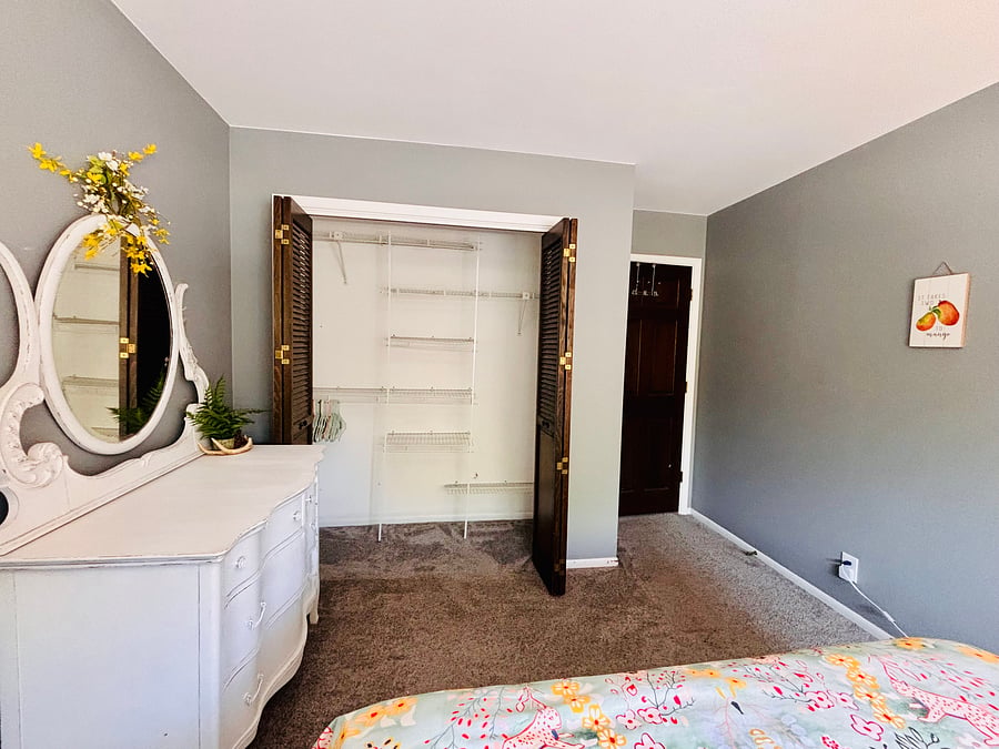 Bedroom 3: Queen bed with spacious closet and dresser.