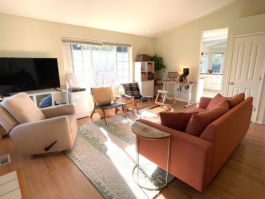 Living room with kitchen in background.