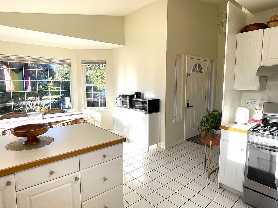 Kitchen and dining room with view of front door entrance.