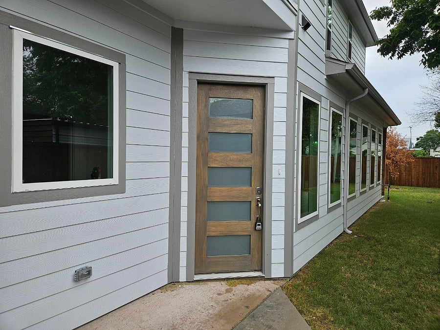 Front door located on the side of the house. Gate entrance off driveway, next to garage