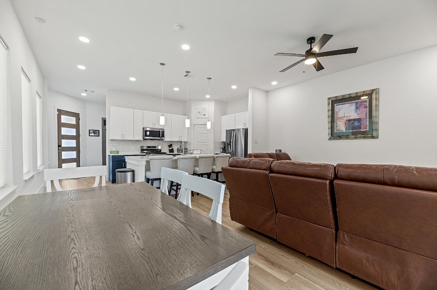 Main floor has 10 foot ceilings and lots of windows. It includes the kitchen, living room and dining area, half bath, laundry room, access to the backyard with patio and two-car garage in the front.
