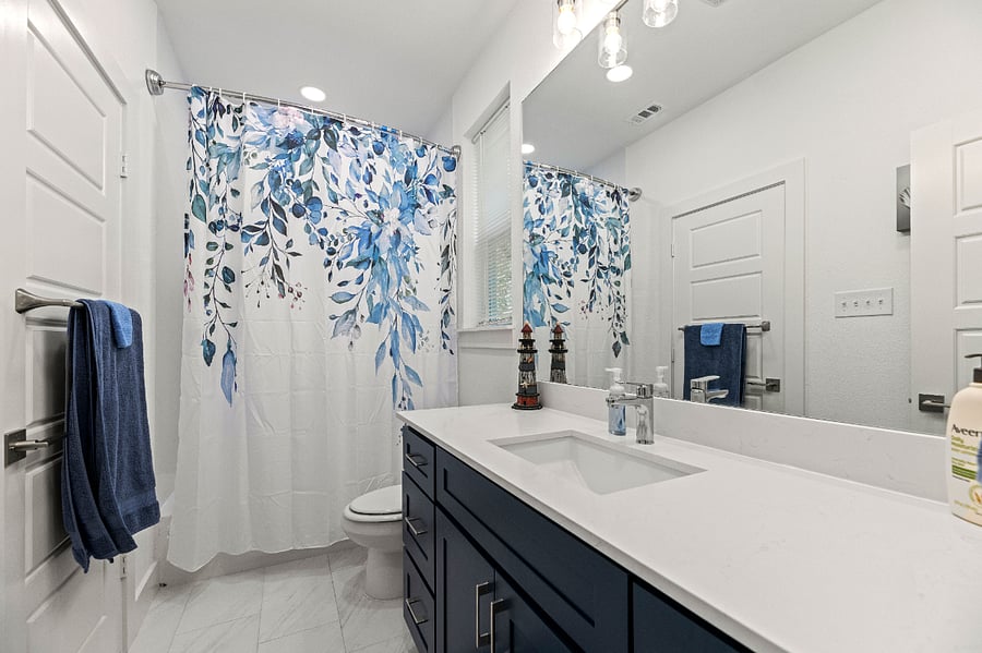 Jack and Jill Bathroom with tub and shower.