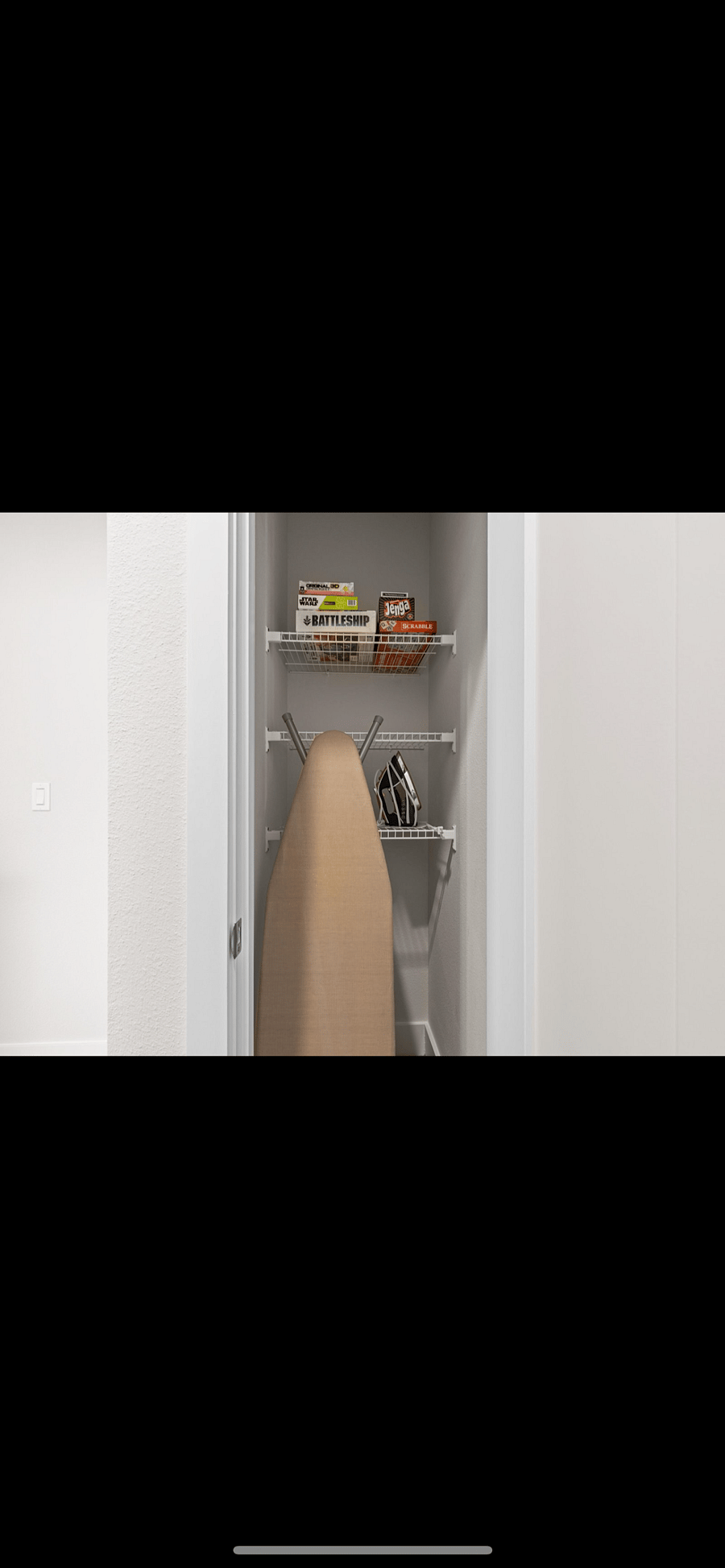 FULL SIZE IRONING BOARD AND IRON.
