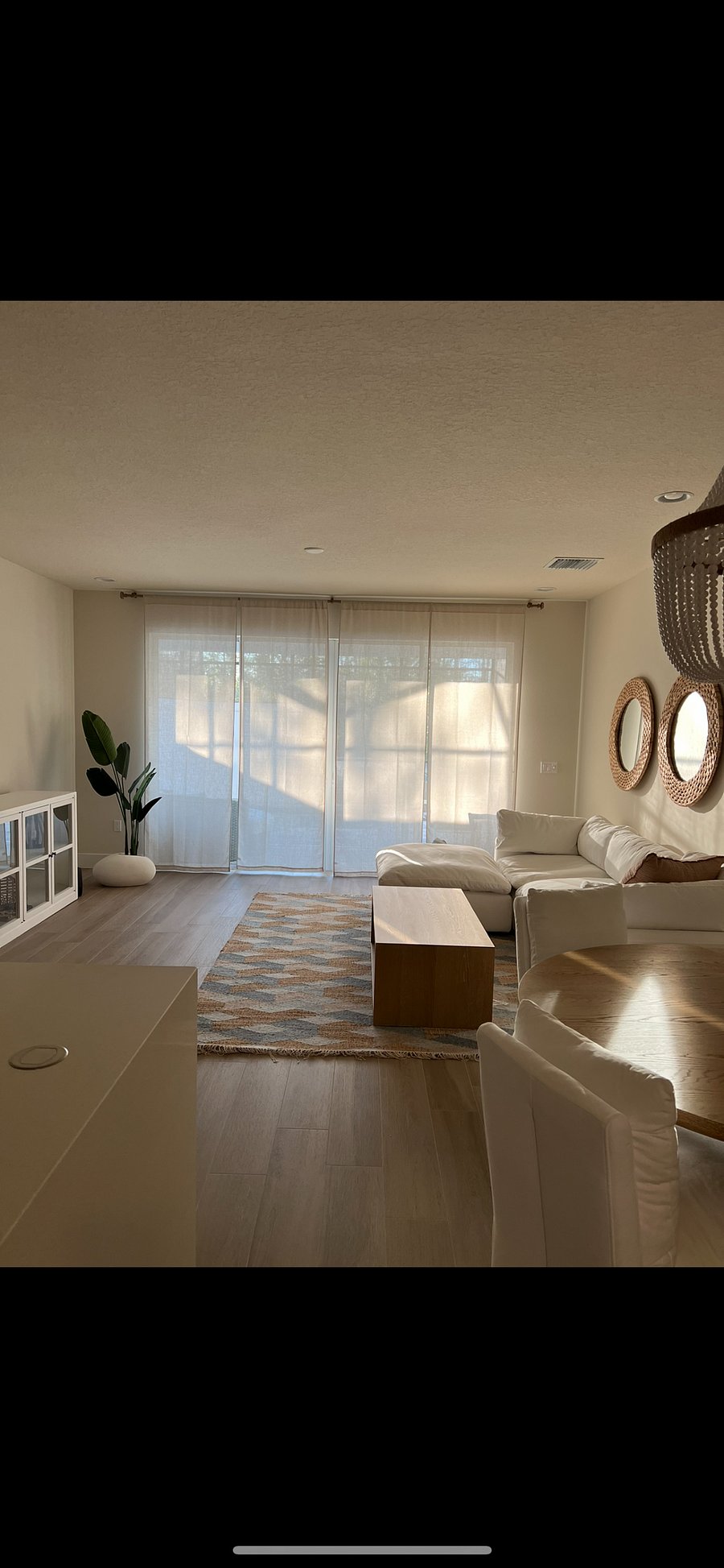 SUNFILLED LIVINGROOM OFF KITCHEN.