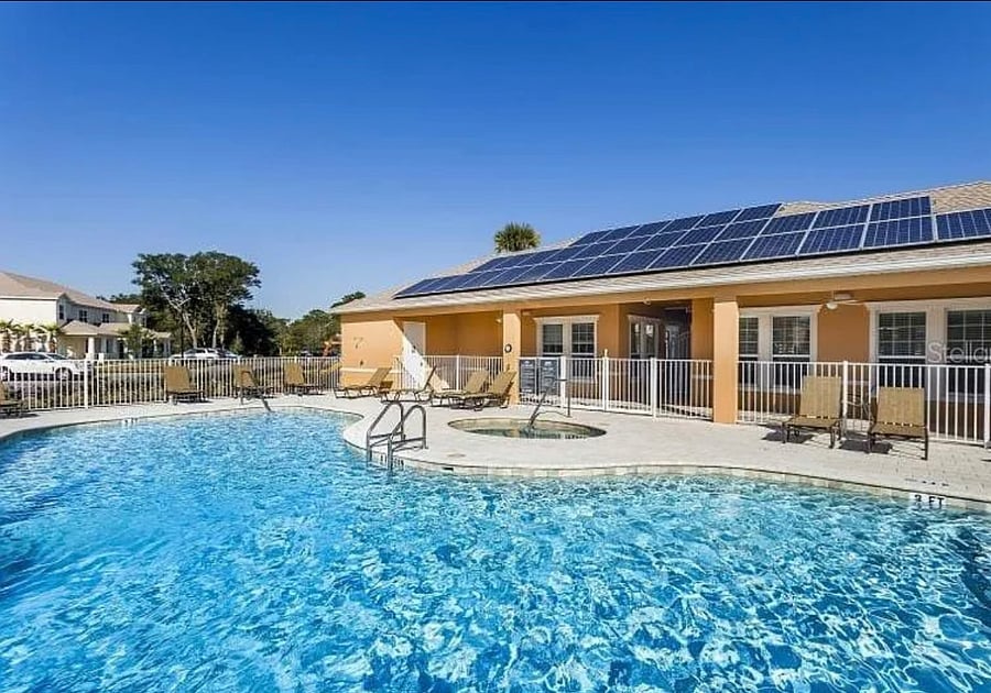 OUR COMMUNITY RESORT POOL WITH HOT TUB AND SUNBATHING AREA. THERE ARE 2 TO USE.