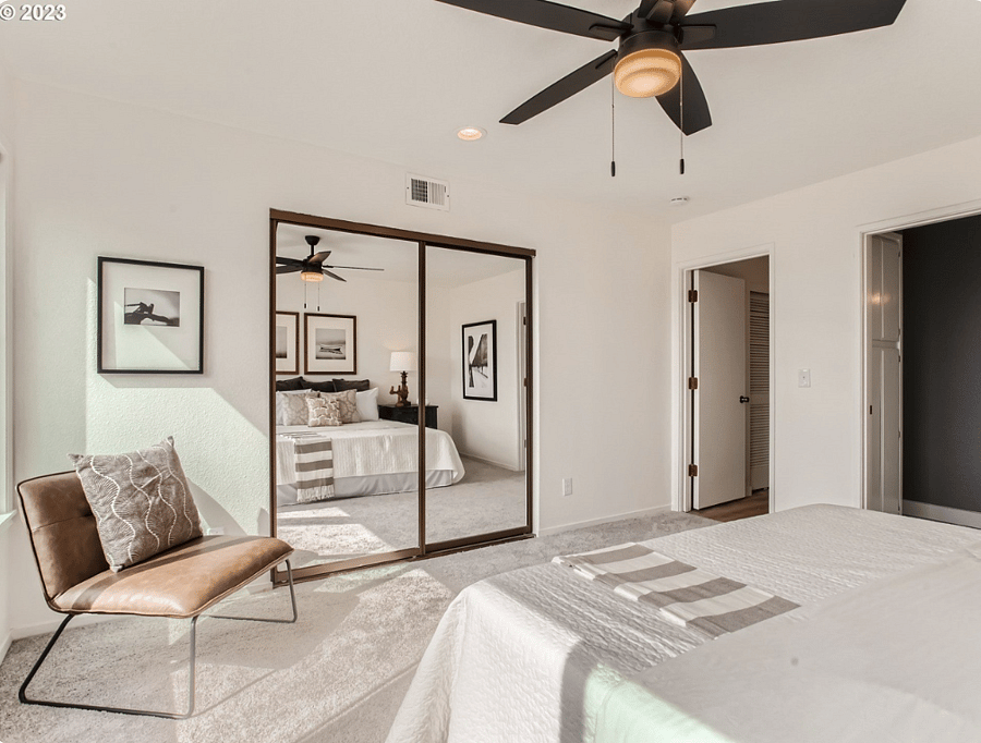 Primary bedroom with mirrored closet