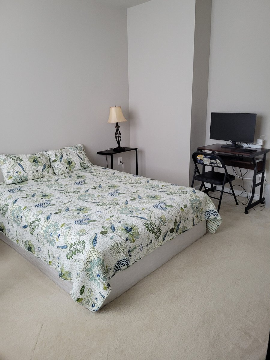 The Alexandra Suite: Upper-Level Bedroom #2 - 161.5 sqft, 11'5-5"x14'1", Queen Size Serta Bed, Quilted 100% Cotton Comforter, Luxury Armchair, Spacious Walk-In Closet w/ Window, Computer Desk, Verizon Fios Internet, Dresser, Lamps. Privacy Locks, Enhanced Security.