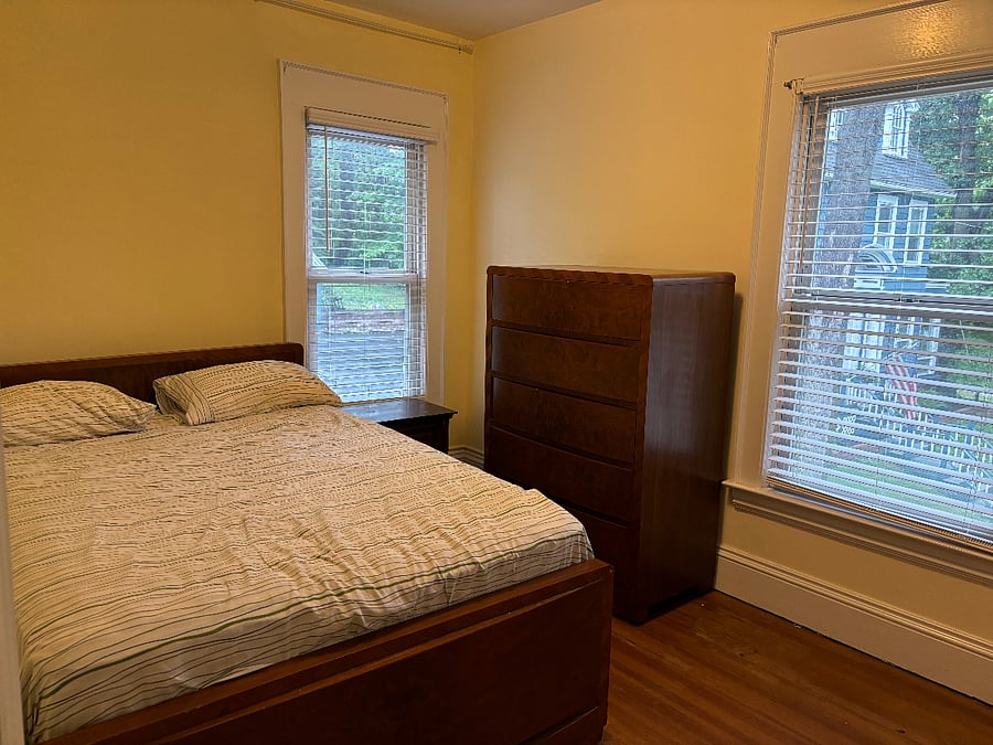 Bedroom 2 available, with available furniture shown (full bed and matching dresser, nightstand).