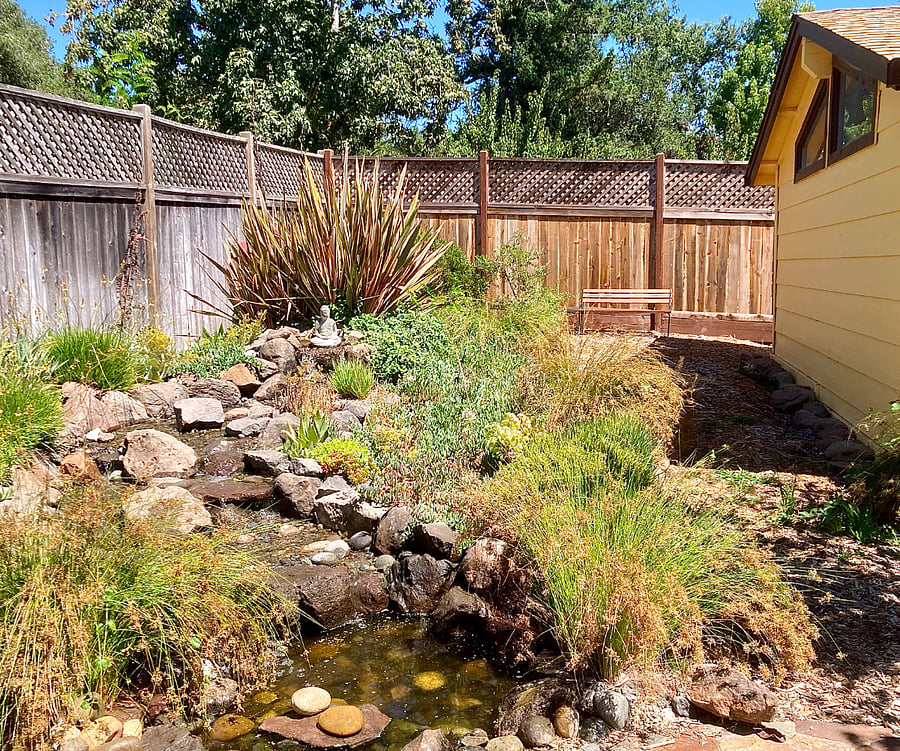 Tenant's outdoor reading area by waterfall