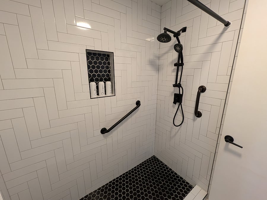 Fixed grab bars added to master shower