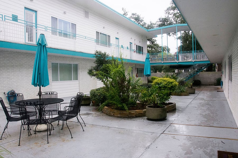 Patio seating near the pool area.