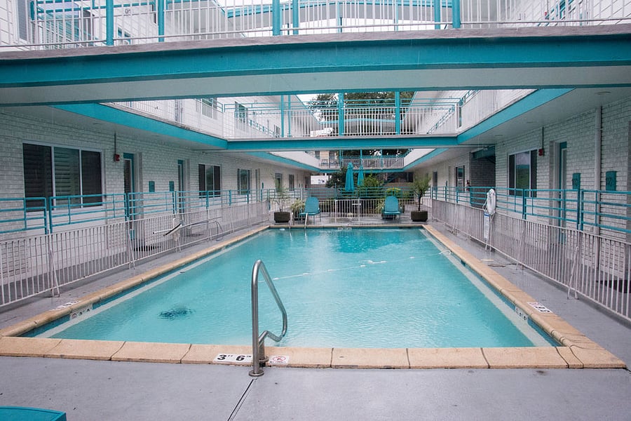 Swimming Pool - Condo is located to the right of the pool.