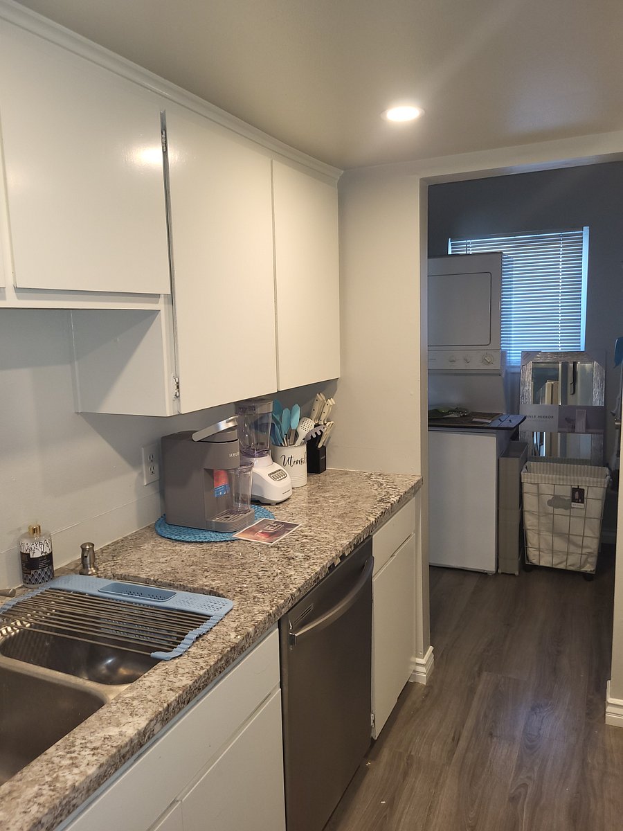 Kitchen with all appliances and dishes