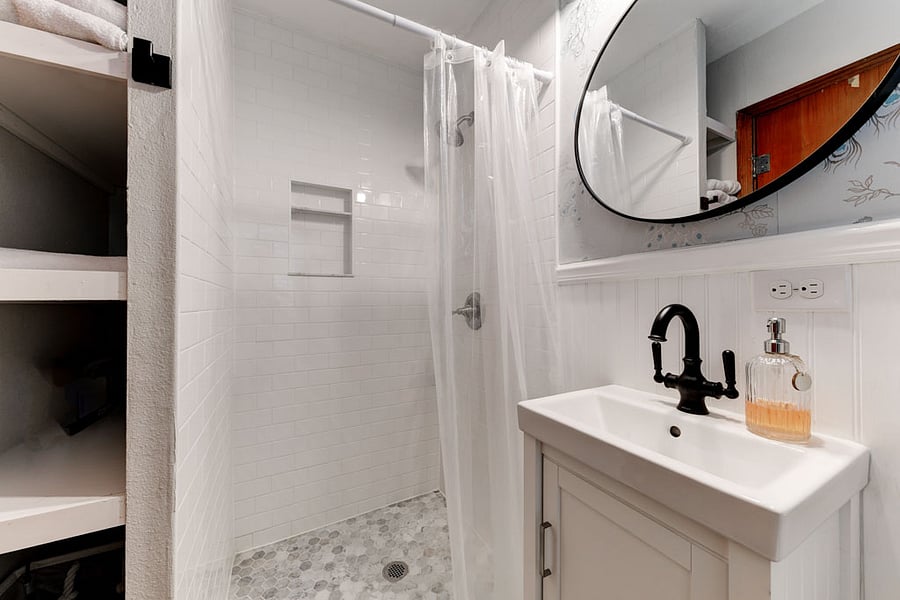 Primary bathroom - on the smaller side but plenty of storage!