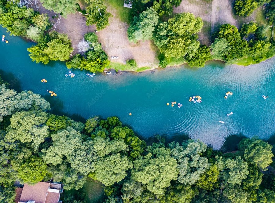 River - we have the Guadalupe and Comal rivers in town.  Perfect for tubing/floating the river and can hang out and grab a drink in the river at the Float In
