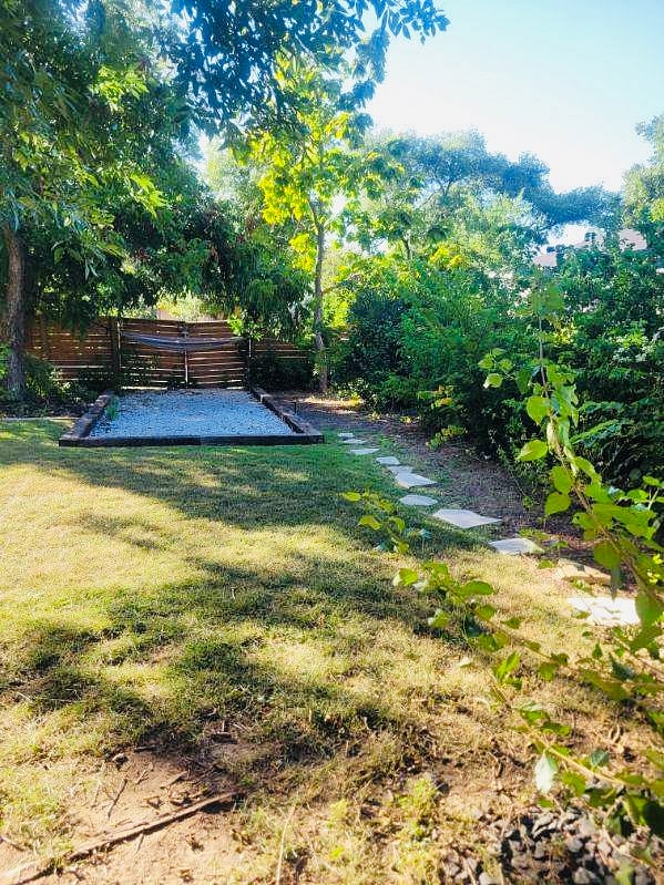 Yard w/ Gate in back for additional car or RV.
