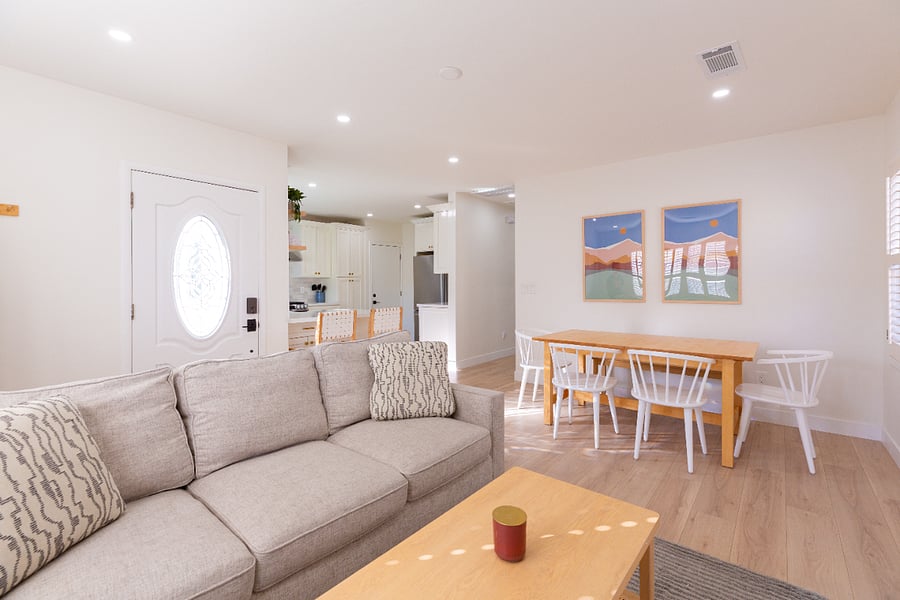 An open concept layout to the kitchen, dining area, and living room allow you to watch TV while cook or eat.