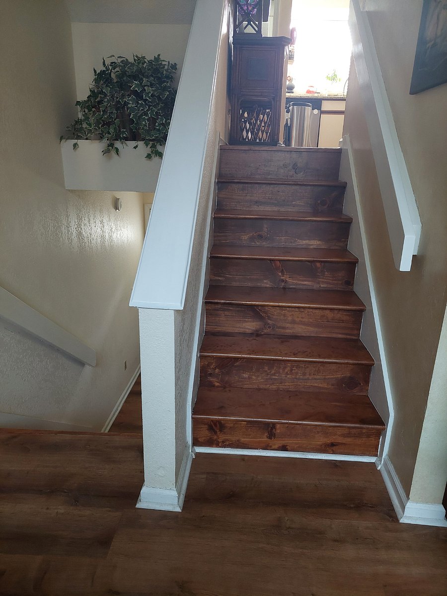 stairs from living area and deck to kitchen dining area