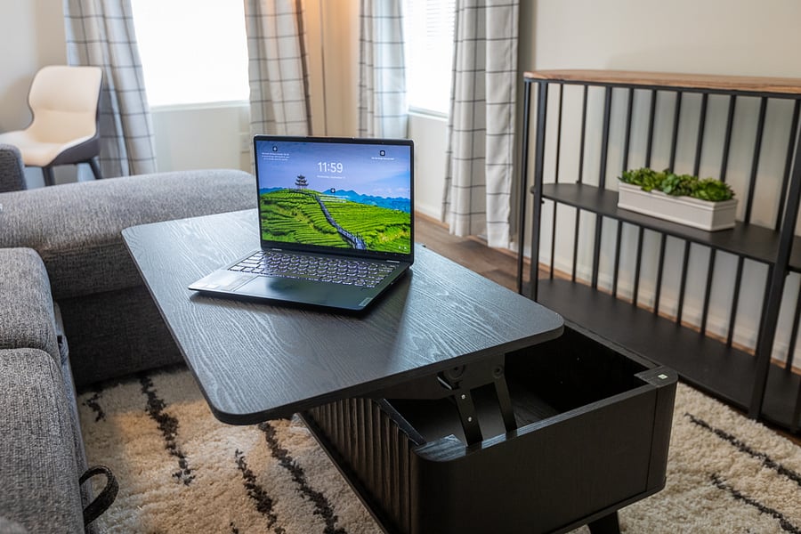 Coffee Table adjusts to serve as a desk or additional eating space.