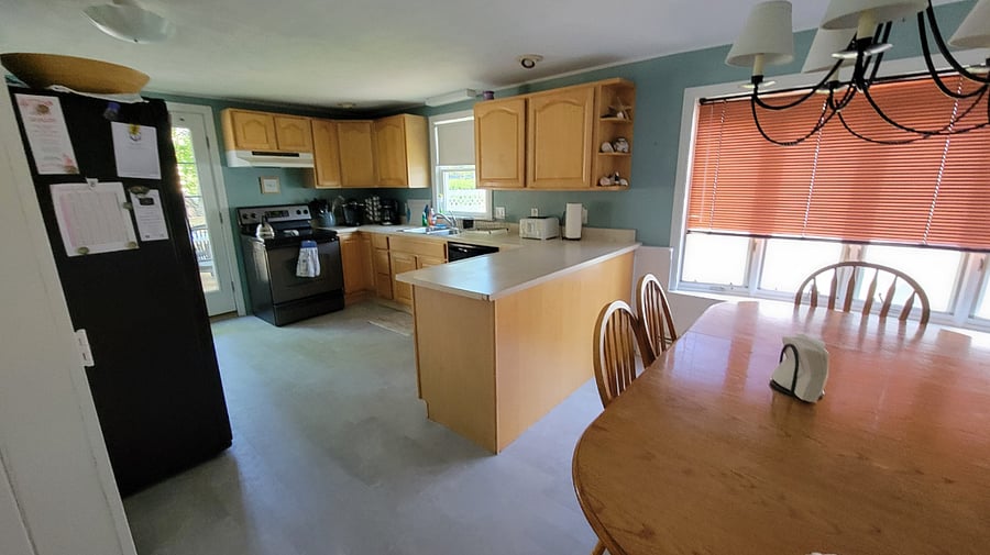 Full kitchen, well stocked with dishes, pots, pans. New flooring.