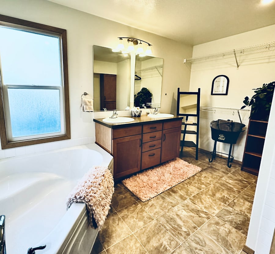 Ensuite bathroom vanity with tub on the lt, toilet on the right and shower behind me.
