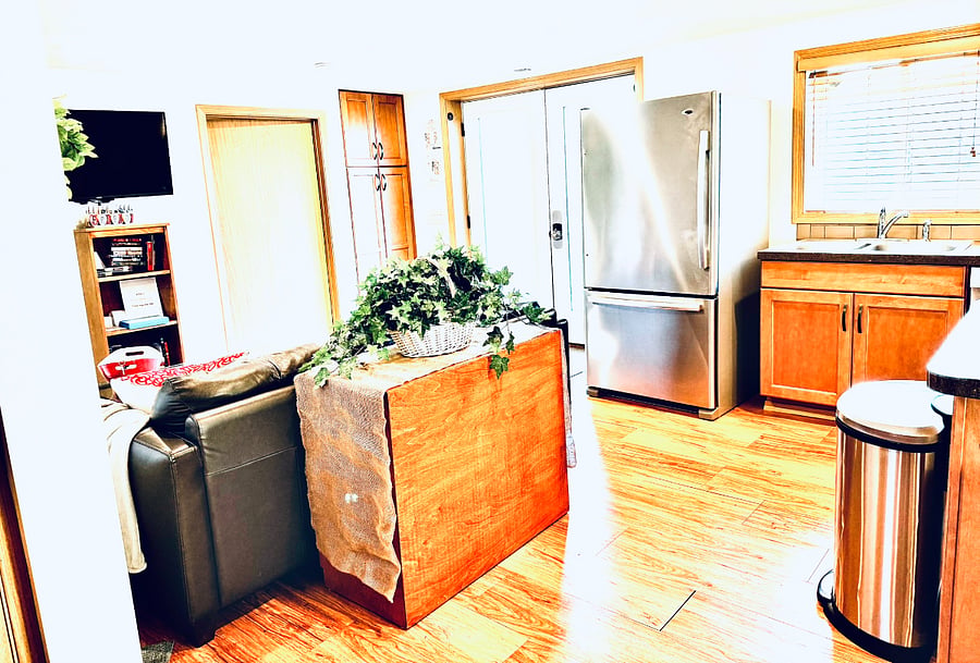 Looking at the entrance to the Private Parking Area. Lt -  TV in the Lower Level common area. Rt - Kitchenette.