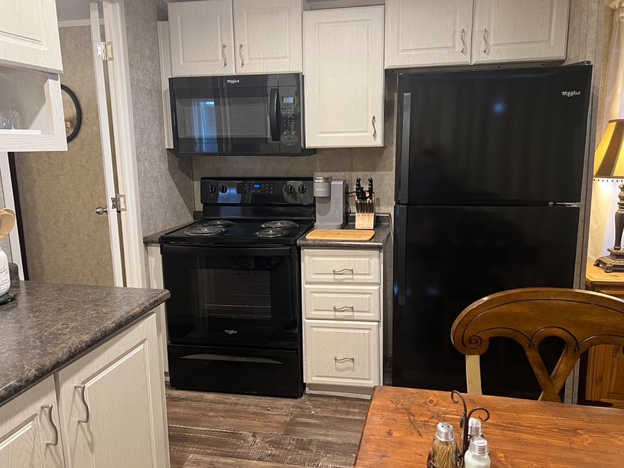 Full size stove, microwave and refrigerator.