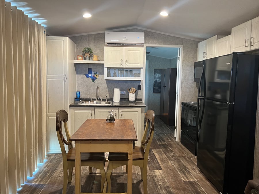 The farm table is over 100 years old.  This kitchen should have everything needed to entertain and cook a nice meal.