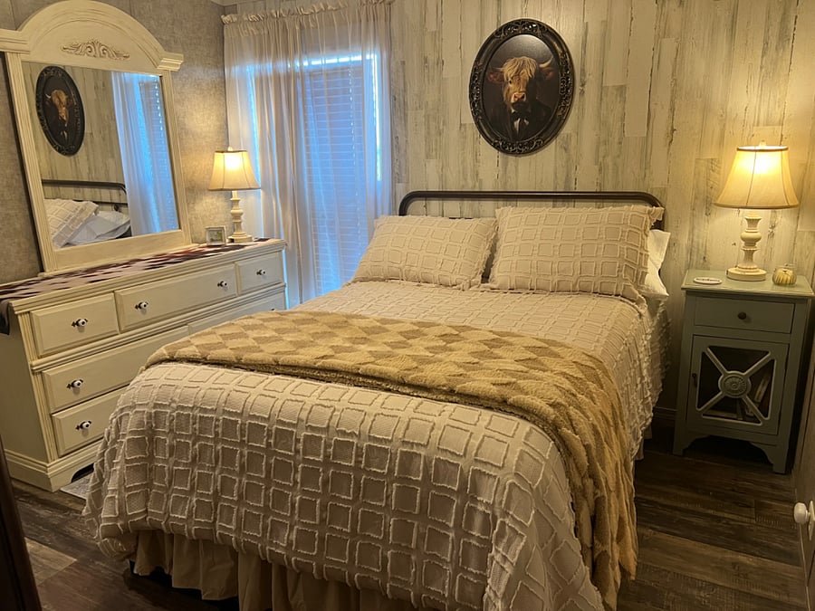Comfortable full size bed with nice linens.  Antique wardrobe.  Enough storage under the bed for luggage.