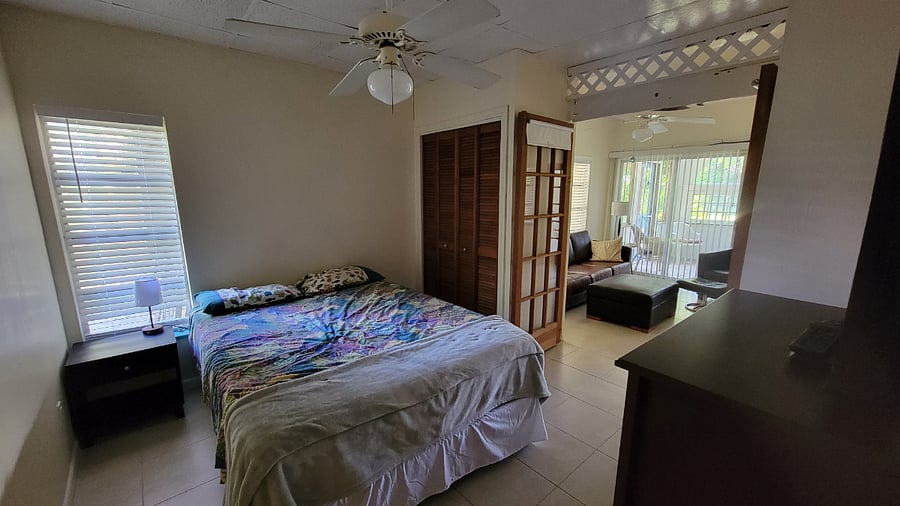 Queen Bed, end table, bureau, closet, lamp with phone charger, flat screen tv, ceiling fan. In suite full bath.