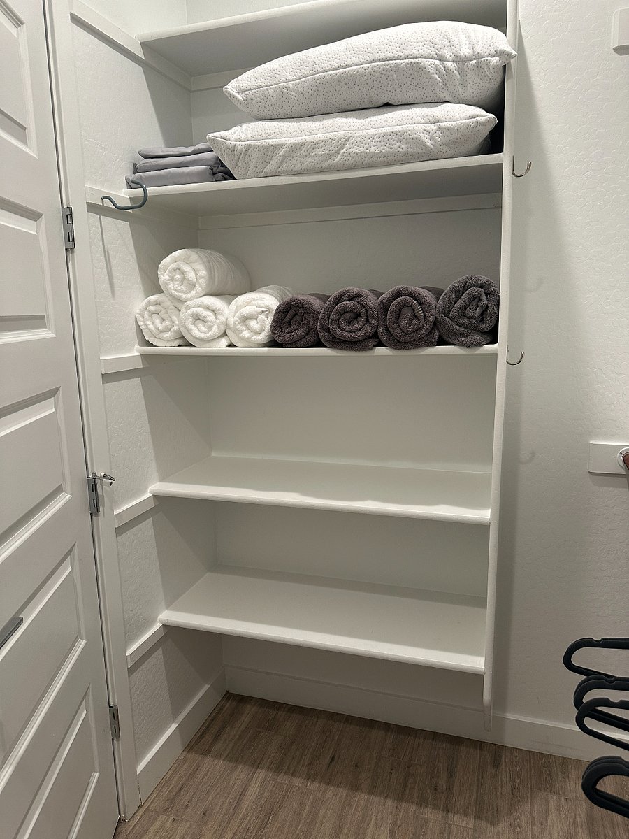 The Owner's bedroom has a spacious walk-in closet. Plenty of extra shelving has been added to the closet, which has ample space for suitcases.