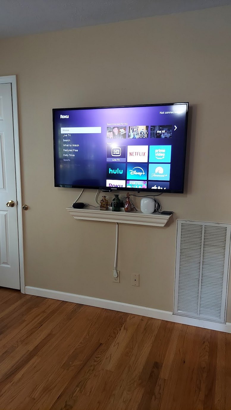 Smart TV in living room, with Roku