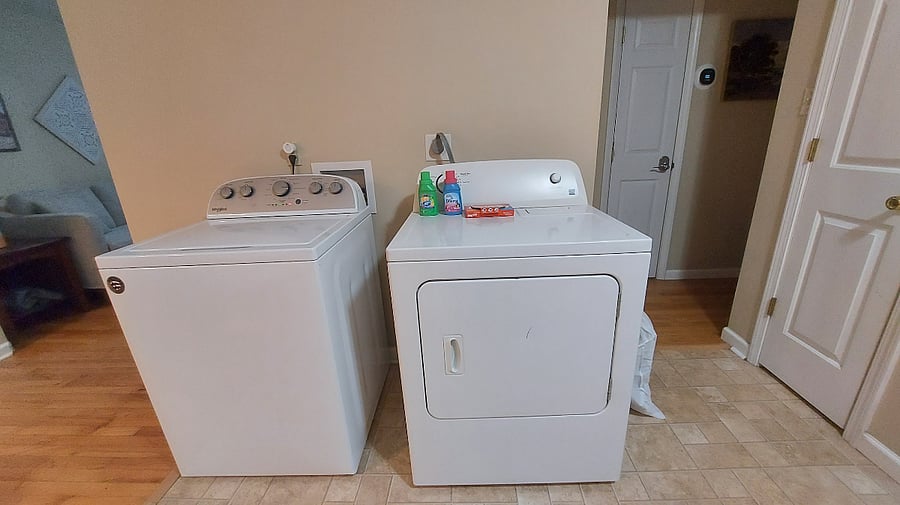 Washer and Dryer in kitchen area.