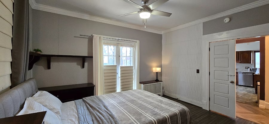 Bedroom #2 with double door to backyard