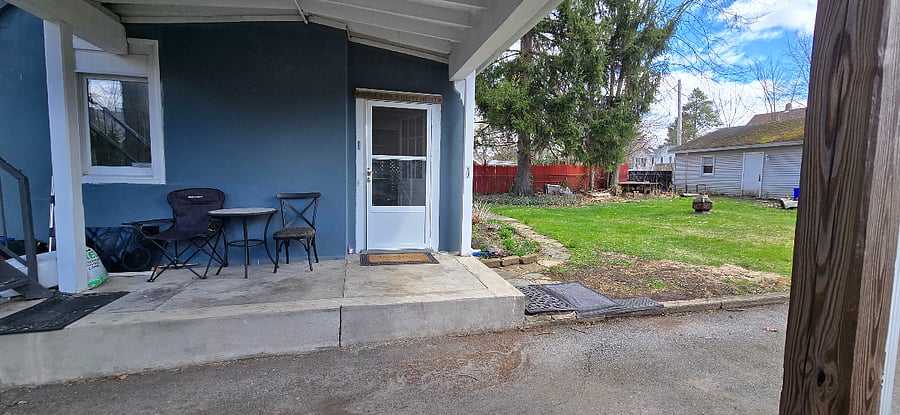 Seating area outside kitchen, carport