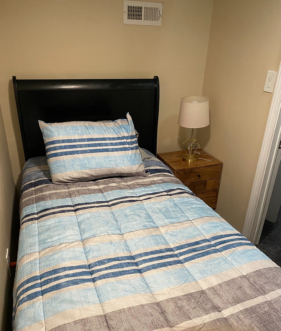 RM #2 Basement Twin Bed, shared full bathroom, common area with Firestick TV.