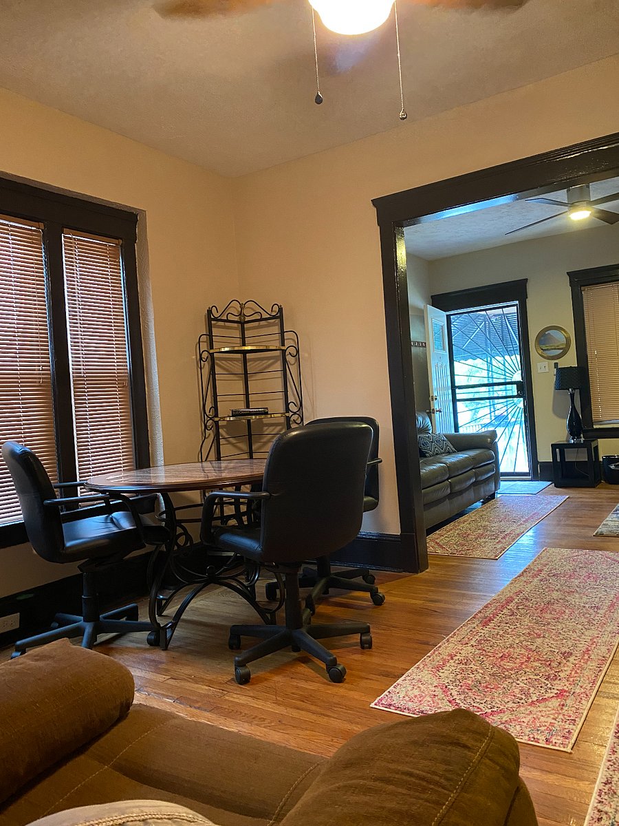 First Floor Common Area: Dinning Table, 3 Chairs, Recliner and Loveseat Futon.