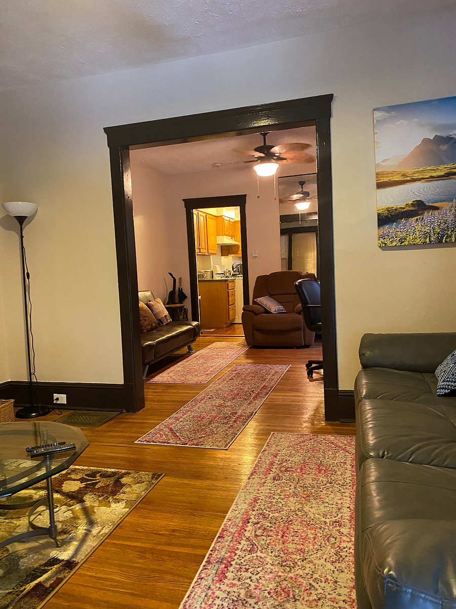 First Floor Common Area: Couch, Ottoman, Recliner and Smart TV.